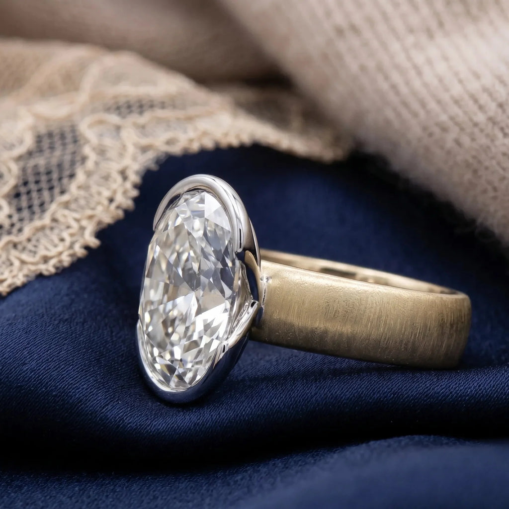 Two-tone gold oval diamond ring