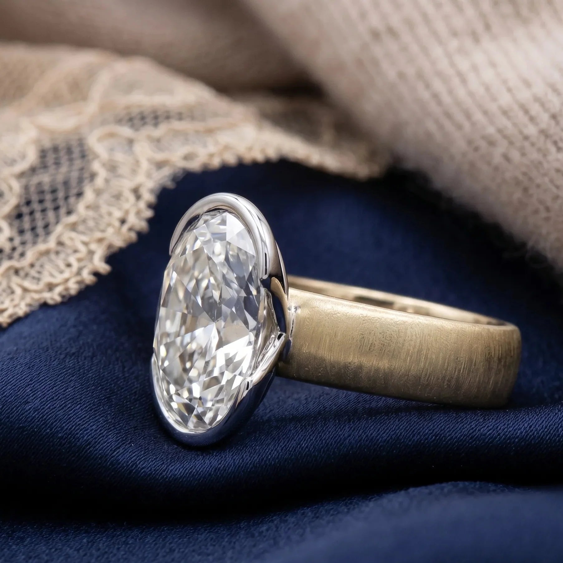 Two-tone gold oval diamond ring