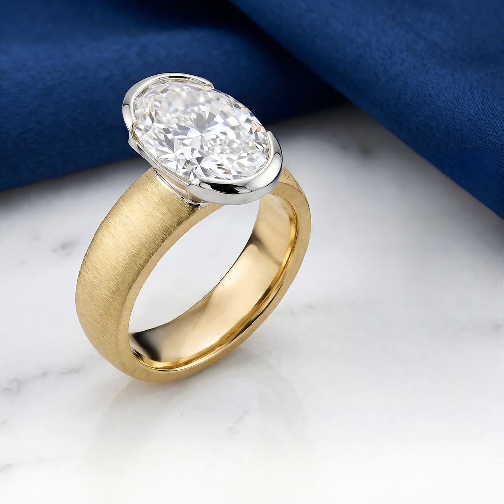 Two-tone gold oval diamond ring